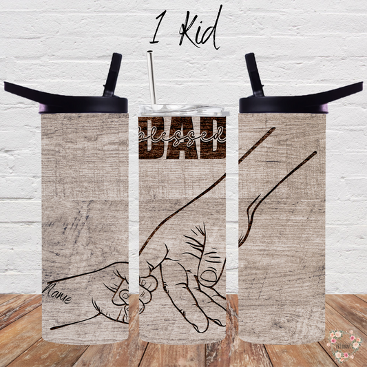 "Personalized rustic wood background tumbler with 'Blessed Dad' engraving and fist bump design, customizable with kids’ names – unique Father’s Day gift.