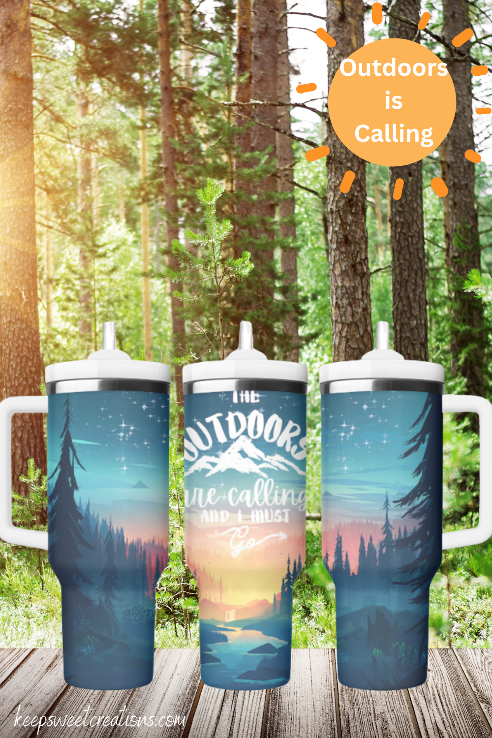 A stainless steel tumbler with a scenic outdoor design, featuring a mountain sunset, tall pine trees, and a reflection on a calm lake. The tumbler displays the phrase "Outdoors is Calling" in elegant script. The set includes tumblers with both metal straws and black flip-top lids. The background varies, including wood textures and white brick walls, enhancing the nature-inspired aesthetic.