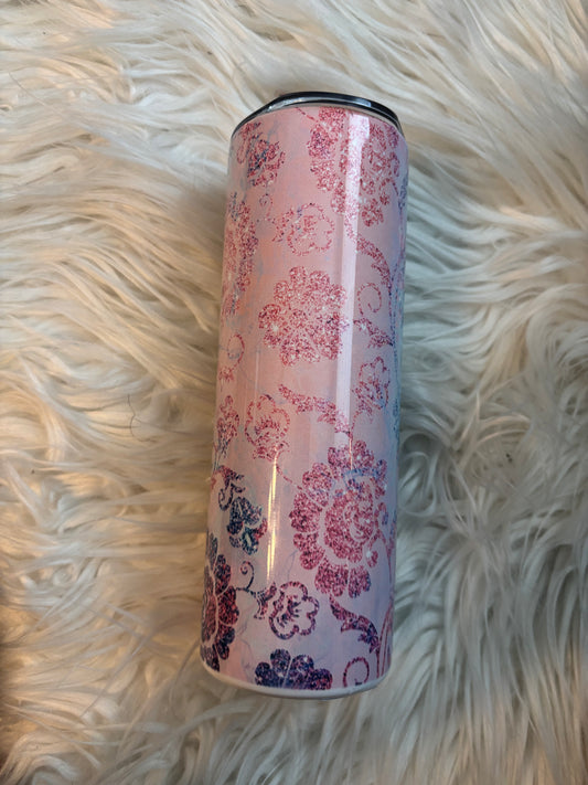 20 oz stainless steel tumbler with pink and blue floral sublimation design on a faux fur background