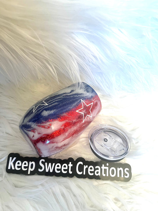 Patriotic Swirl Glitter Tumbler with red, white, and blue swirl and stars