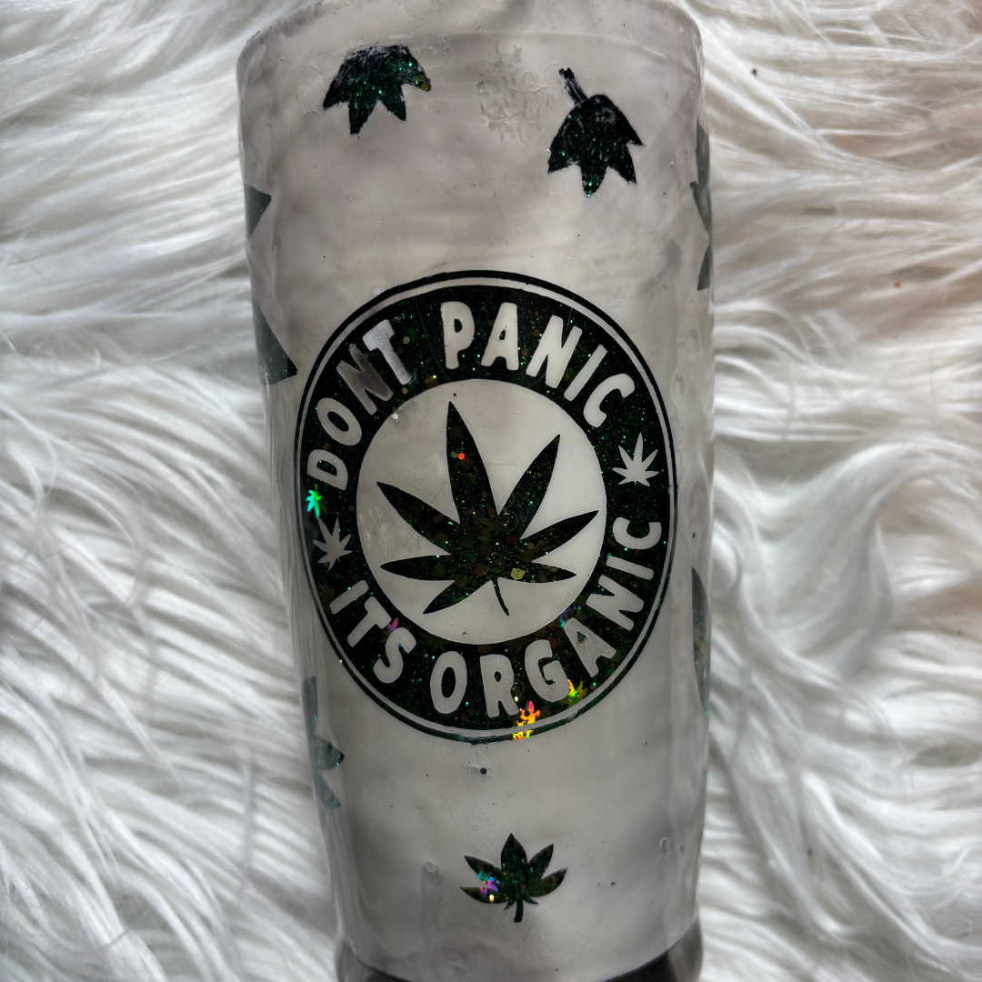 20 oz Don't Panic It's Organic tumbler with frosted finish and green leaf glitter design on a light green background