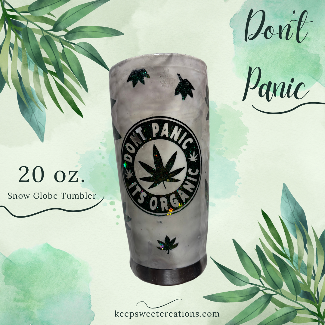 20 oz Don't Panic It's Organic tumbler with frosted finish and green leaf glitter design on a light green background