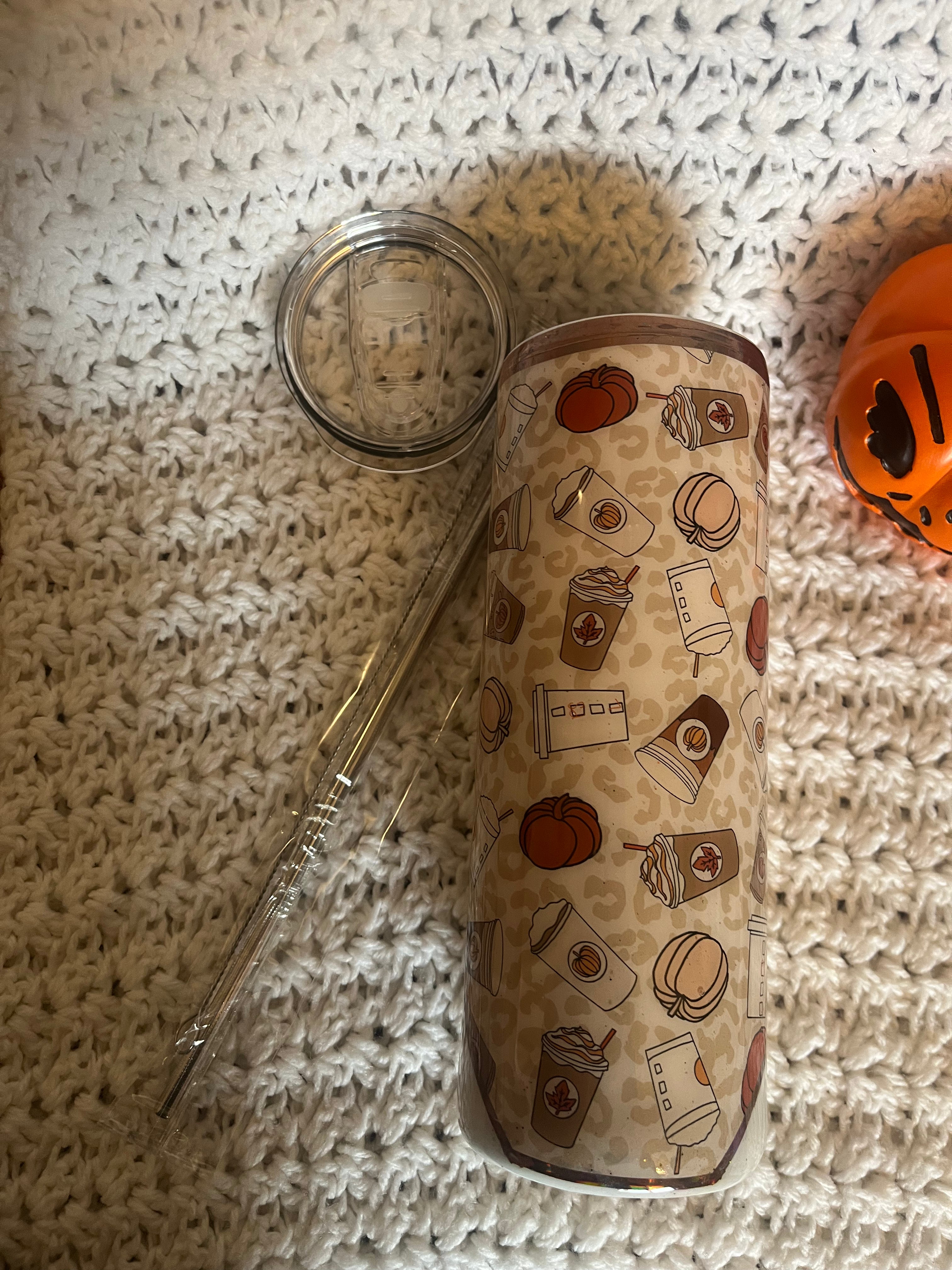 20 oz tumbler with autumn tones, coffee cup graphics, and “Pumpkin Spice and Living My Best Life” quote, includes lid and straw