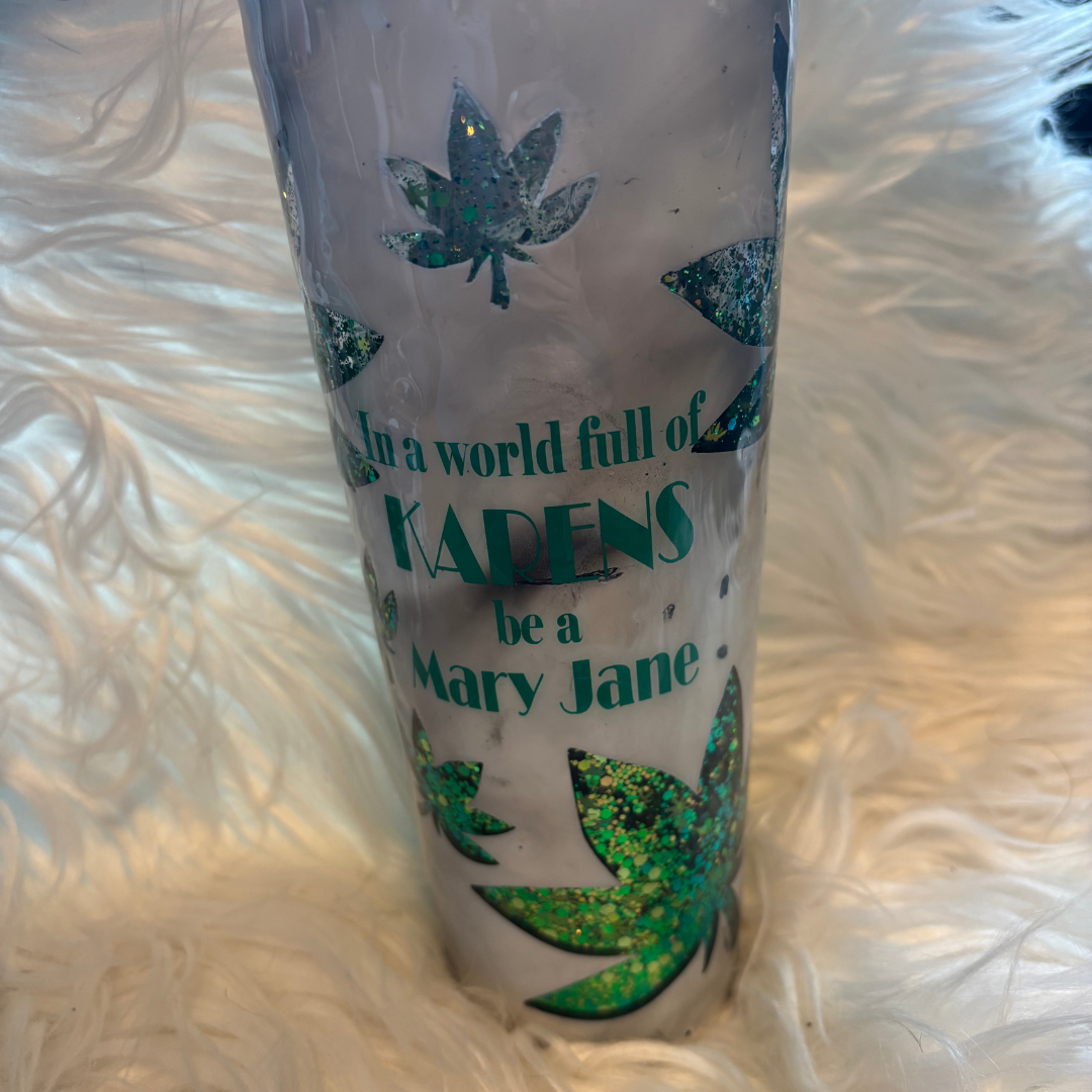 24 oz tumbler with product label, frosted glass and green leaf glitter inside