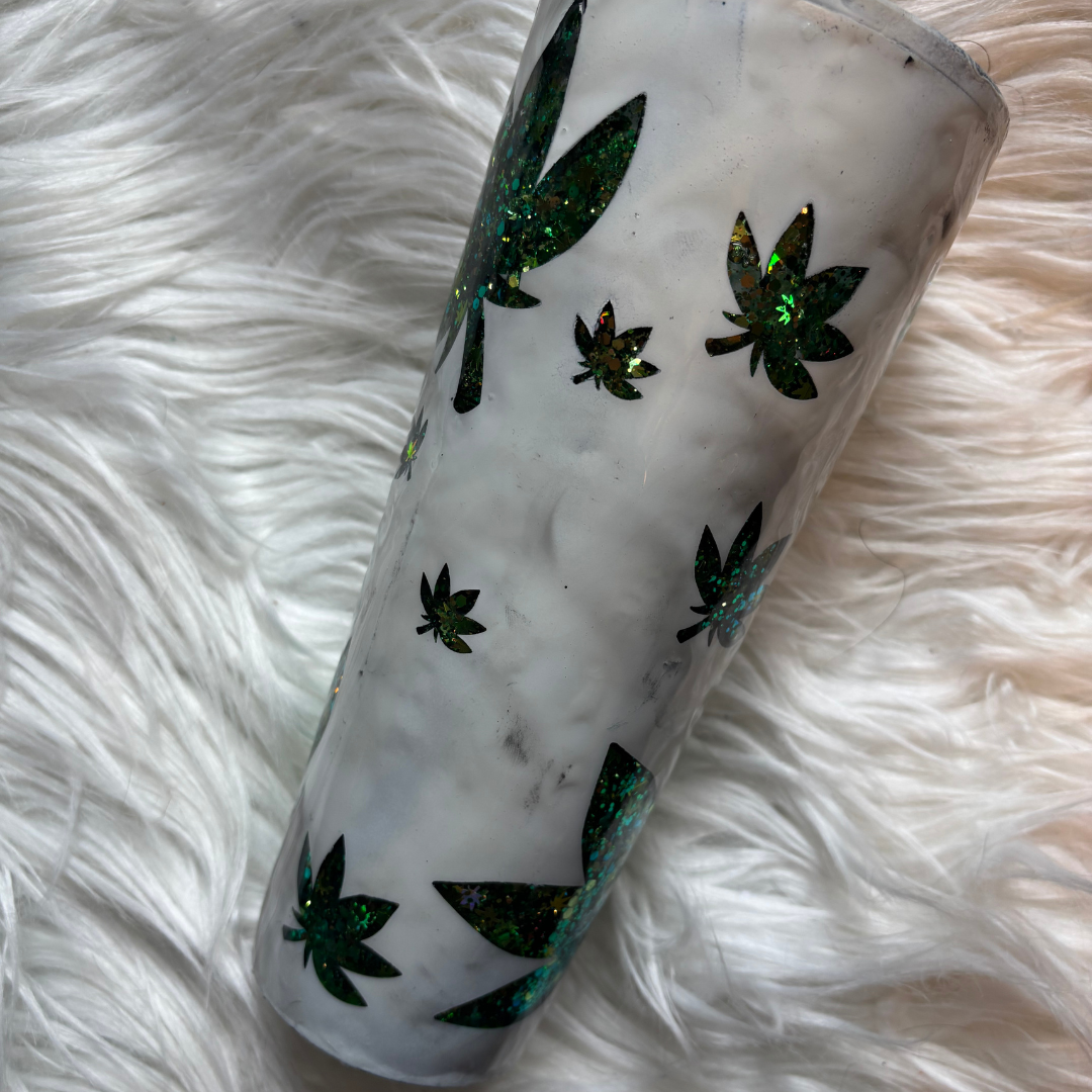 24 oz tumbler with product label, frosted glass and green leaf glitter inside