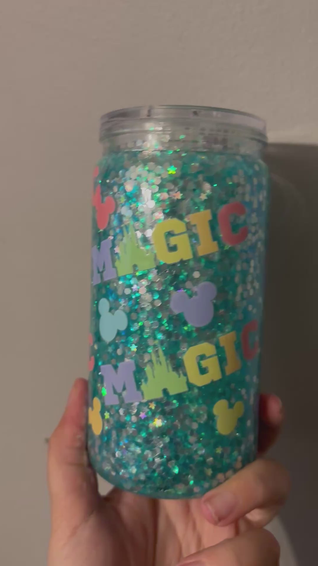 Magic snow globe tumbler with floating glitter effect, custom handmade glitter cup for iced coffee and cold drinks